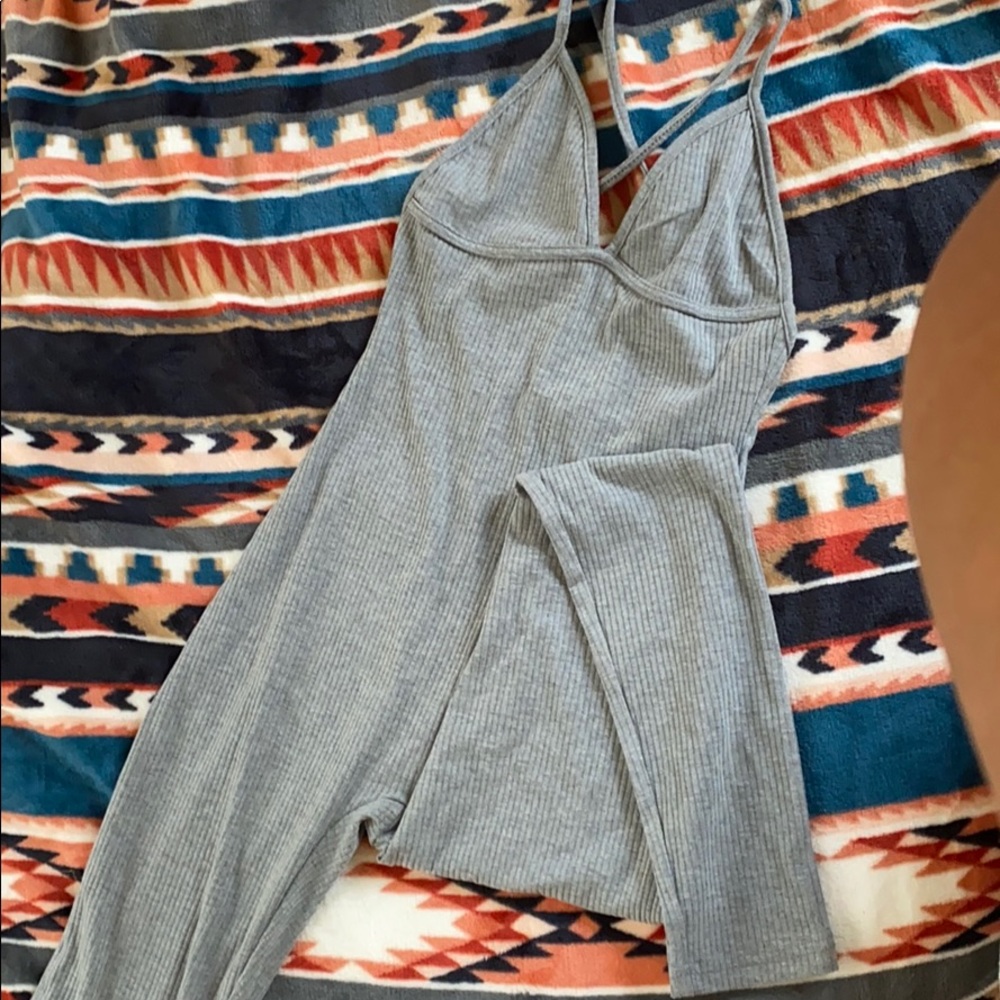 Grey jumper/one piece. Cross back. Size small.